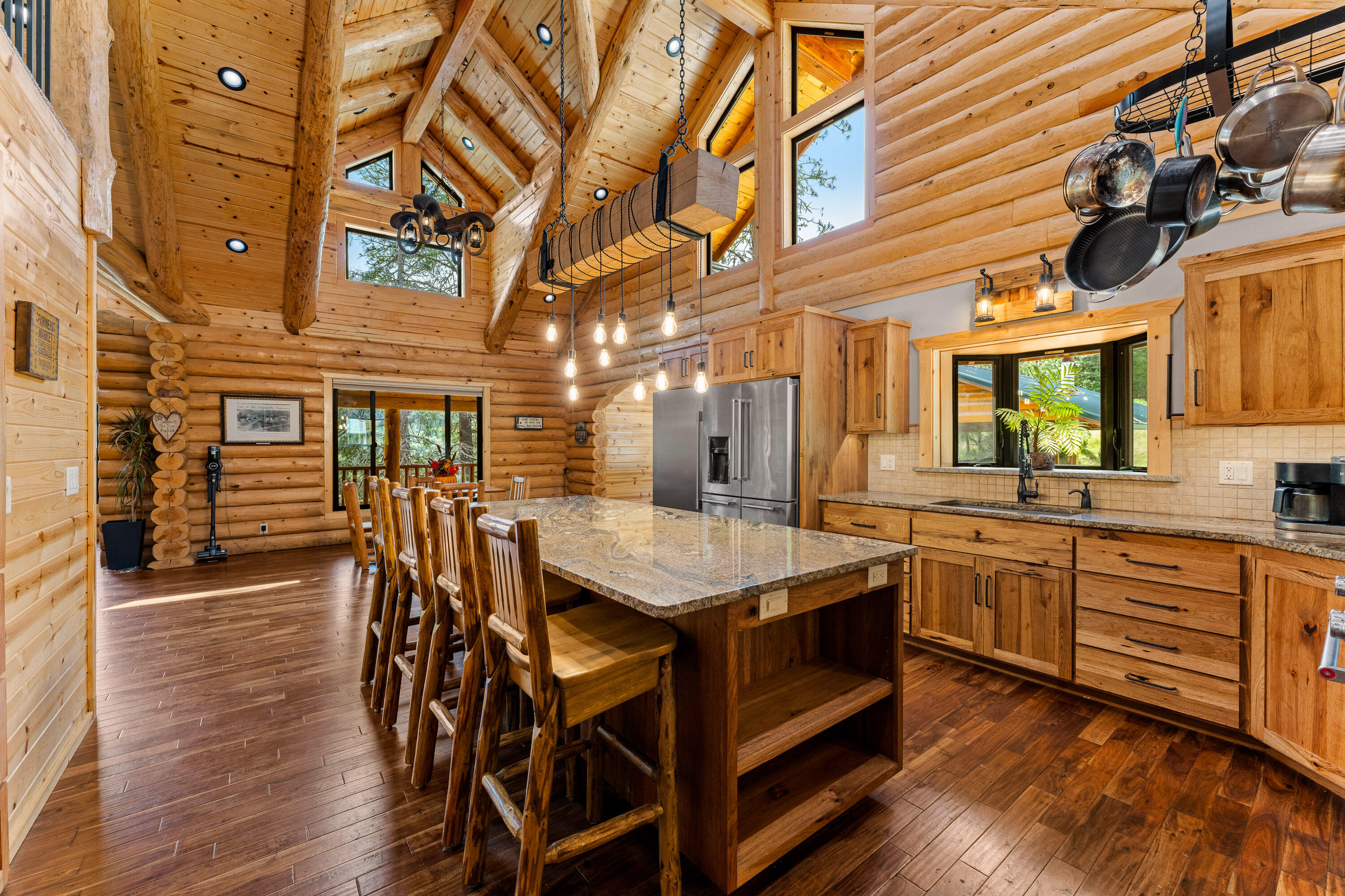 225 Eagle Ridge Road Canyonville, OR 97417 - Photo 29 of 52 a dining hall with stainless steel appliances granite countertop a stove and cabinets with wooden floor