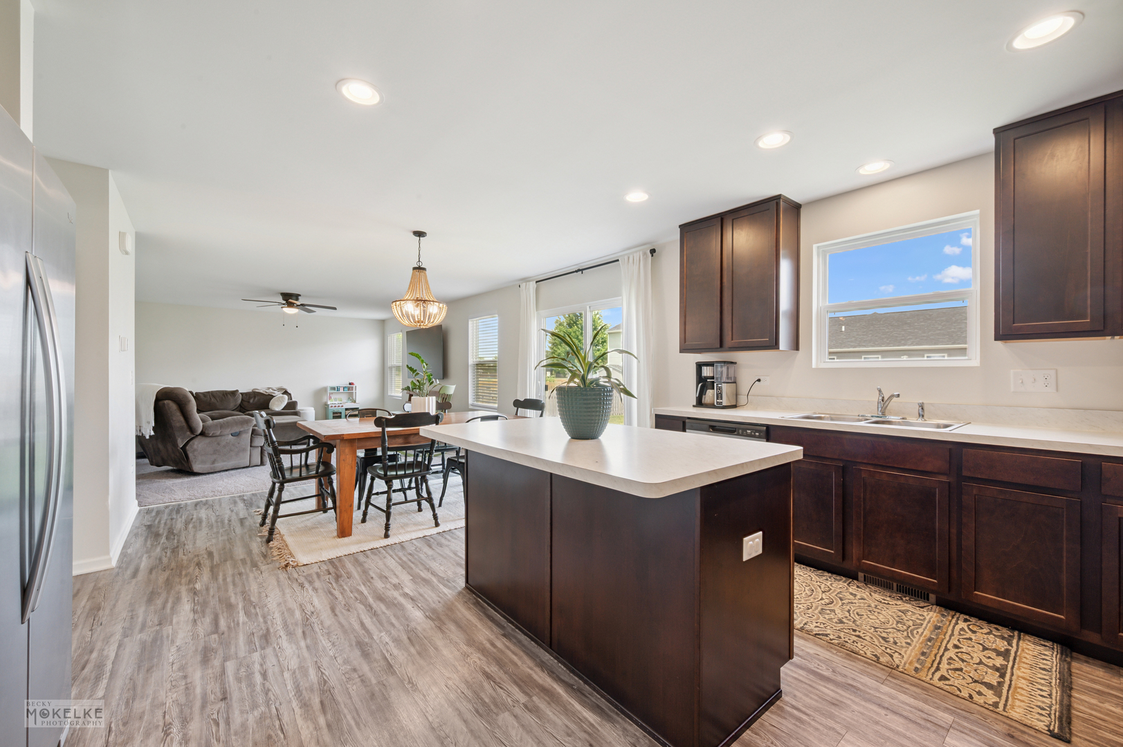 1024 Daniel Street Plano, IL 60545 - Photo 14 of 27 a kitchen with sink cabinets and wooden floor