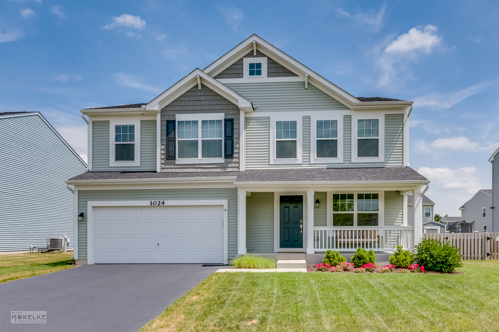 1024 Daniel Street Plano, IL 60545 - Photo 2 of 27 a front view of a house with a yard and porch