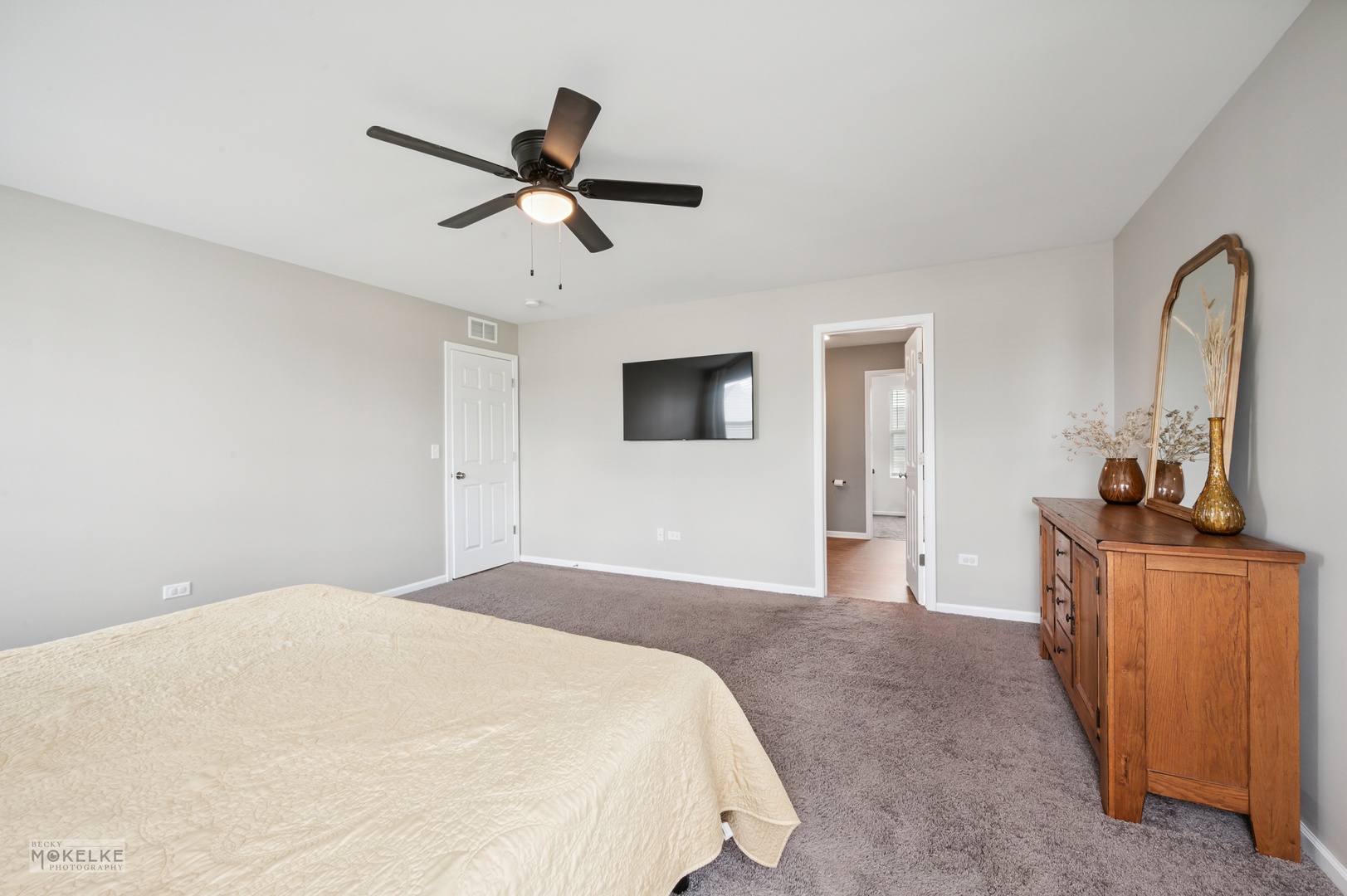 1024 Daniel Street Plano, IL 60545 - Photo 24 of 27 a bedroom with a bed and a flat screen tv