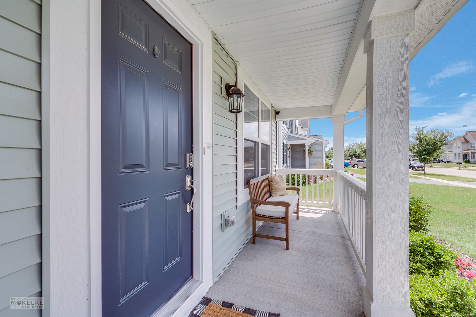 1024 Daniel Street Plano, IL 60545 - Photo 7 of 27 a balcony with chairs and a potted plant