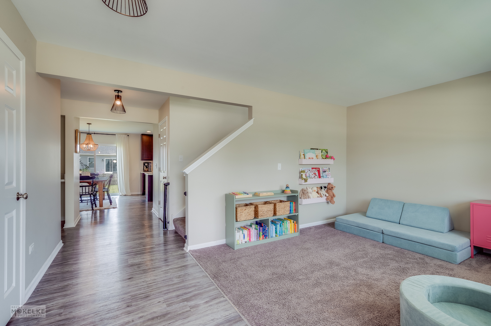 1024 Daniel Street Plano, IL 60545 - Photo 8 of 27 a living room with furniture and a book shelf