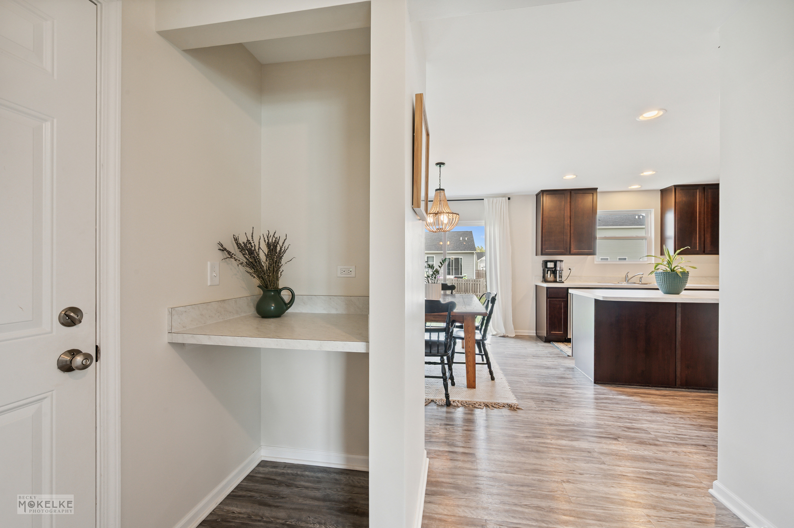 1024 Daniel Street Plano, IL 60545 - Photo 10 of 27 a kitchen with stainless steel appliances a refrigerator and a wooden floor