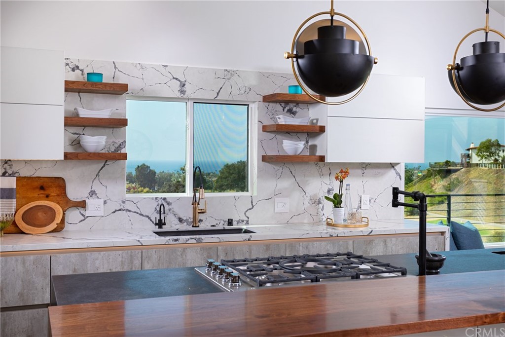 447 Avenida Crespi San Clemente, CA 92672 - Photo 16 of 42 a kitchen with a stove a microwave and cabinets