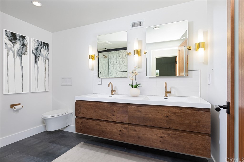 447 Avenida Crespi San Clemente, CA 92672 - Photo 24 of 42 a bathroom with a double vanity sink mirror and bathtub