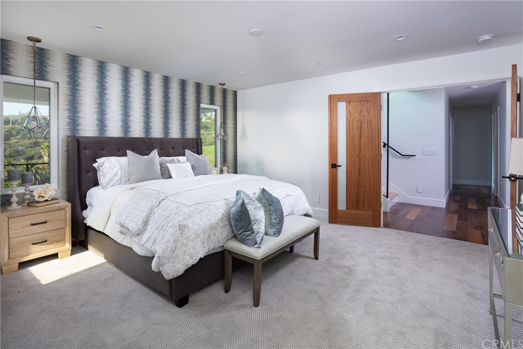 447 Avenida Crespi San Clemente, CA 92672 - Photo 31 of 42 a spacious bedroom with a bed and a dresser