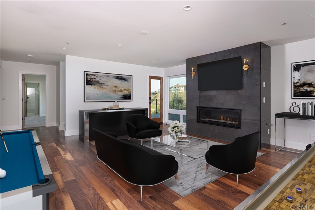 447 Avenida Crespi San Clemente, CA 92672 - Photo 33 of 42 a living room with furniture a flat screen tv and a fireplace