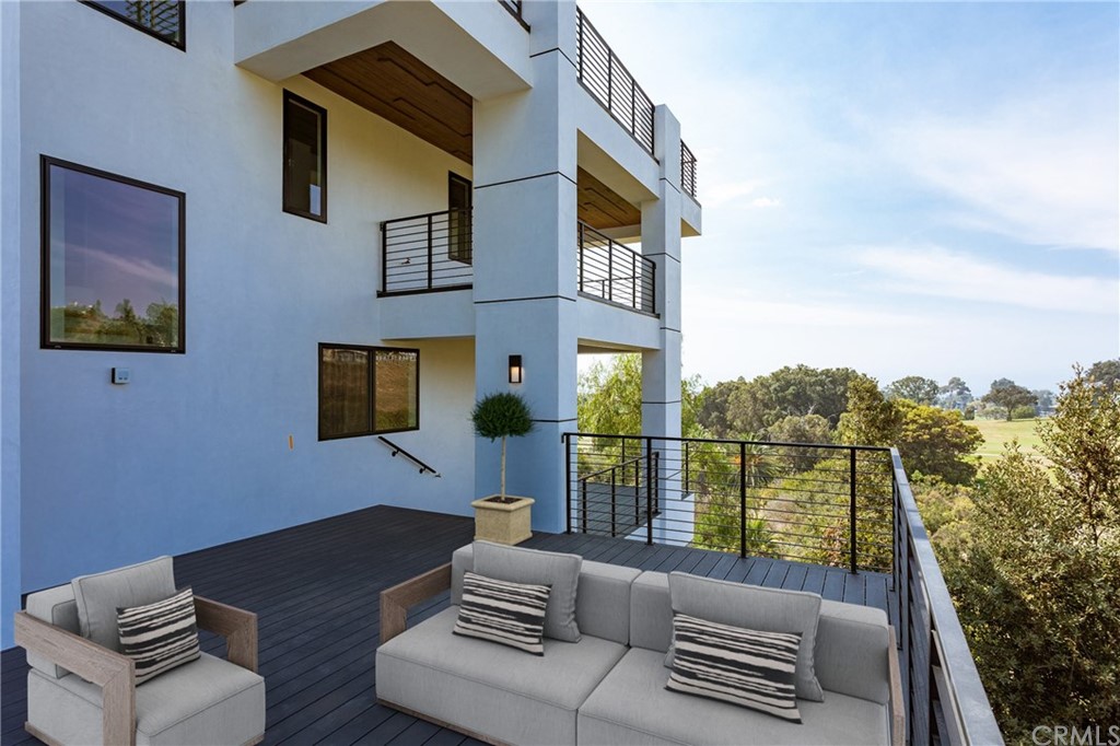 447 Avenida Crespi San Clemente, CA 92672 - Photo 35 of 42 a balcony view with a couch and wooden floor
