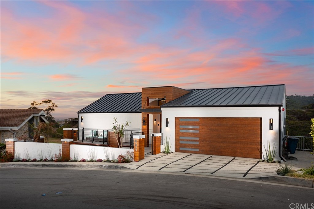 447 Avenida Crespi San Clemente, CA 92672 - Photo 4 of 42 a front view of a house with garage