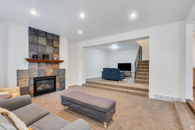 3221 North Shadowbrook Circle Provo, UT 84604 - Photo 2 of 29 Living area featuring a fireplace, carpet flooring, and recessed lighting