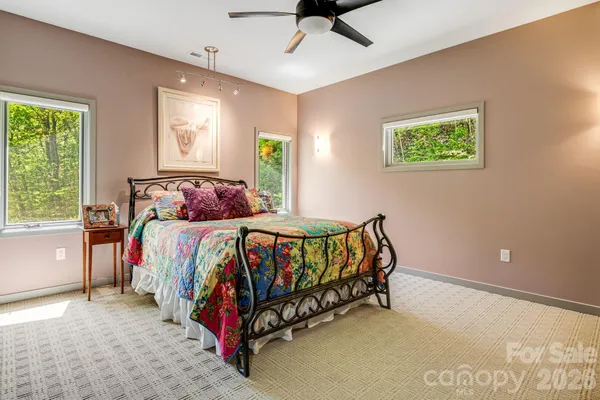 a bedroom with a bed and window