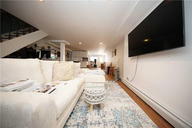 a living room with a couch and a flat screen tv