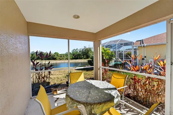 a view of a chairs and table in a patio