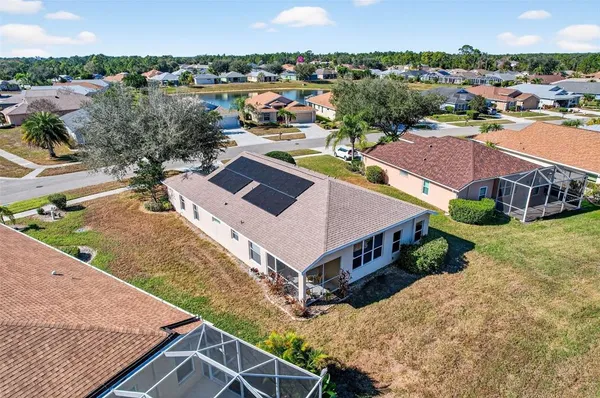 an aerial view of a house with a garden