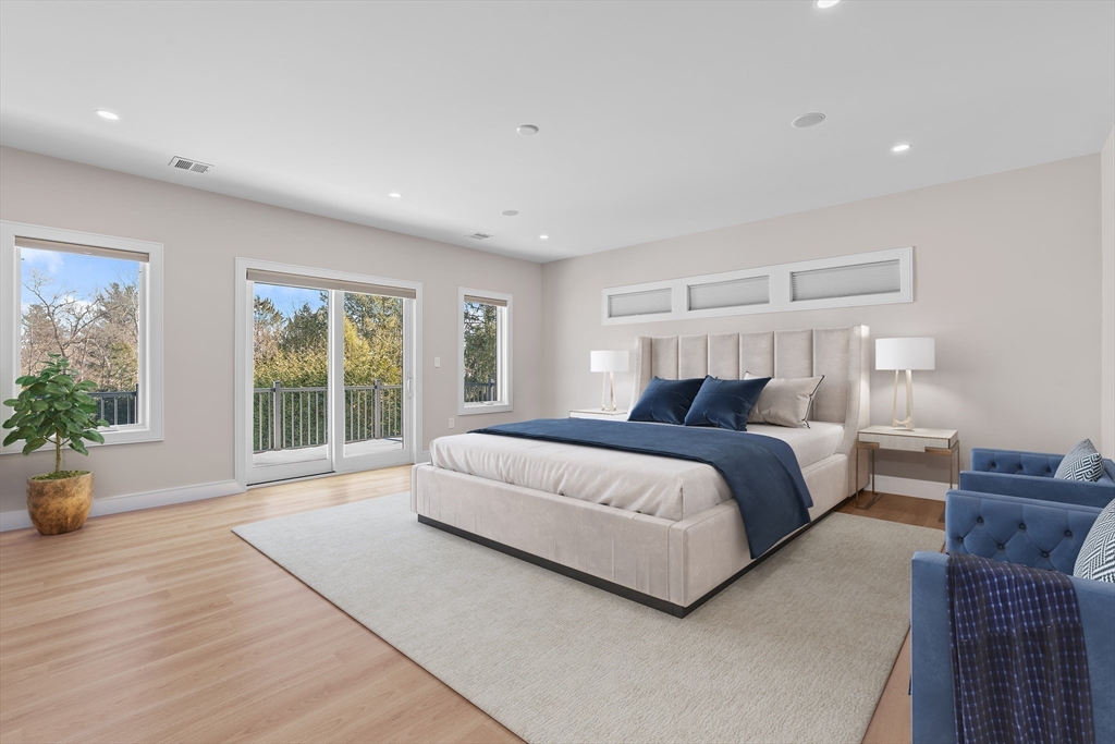 5 Colonial Road, Unit 5 Needham, MA 02492 - Photo 15 of 35 a bedroom with a large bed and a large window