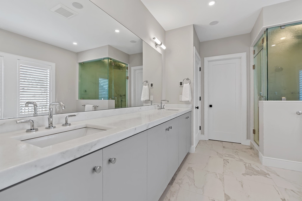 5 Colonial Road, Unit 5 Needham, MA 02492 - Photo 17 of 35 a spacious bathroom with a double vanity sink mirror and double