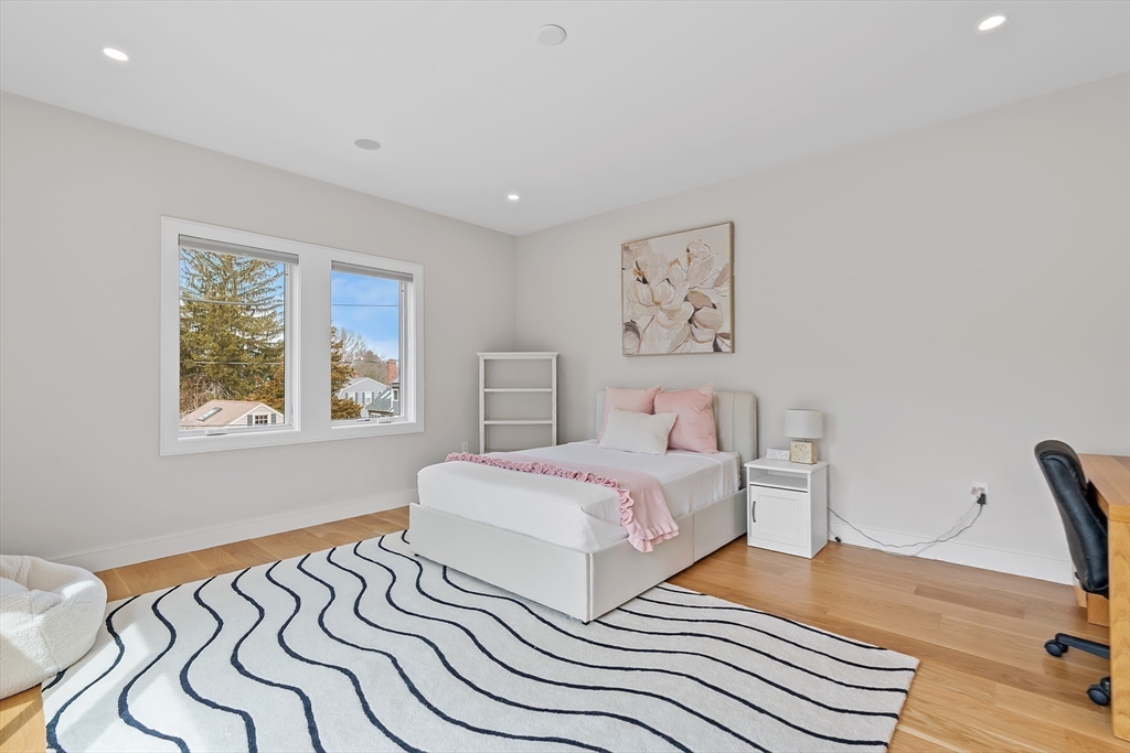 5 Colonial Road, Unit 5 Needham, MA 02492 - Photo 21 of 35 a bedroom with double bed and a window