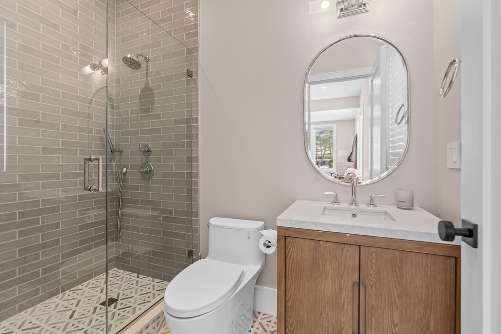 5 Colonial Road, Unit 5 Needham, MA 02492 - Photo 23 of 35 a bathroom with a sink a toilet and shower