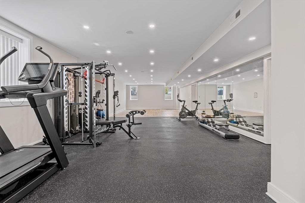 5 Colonial Road, Unit 5 Needham, MA 02492 - Photo 29 of 35 a view of a room with gym equipment