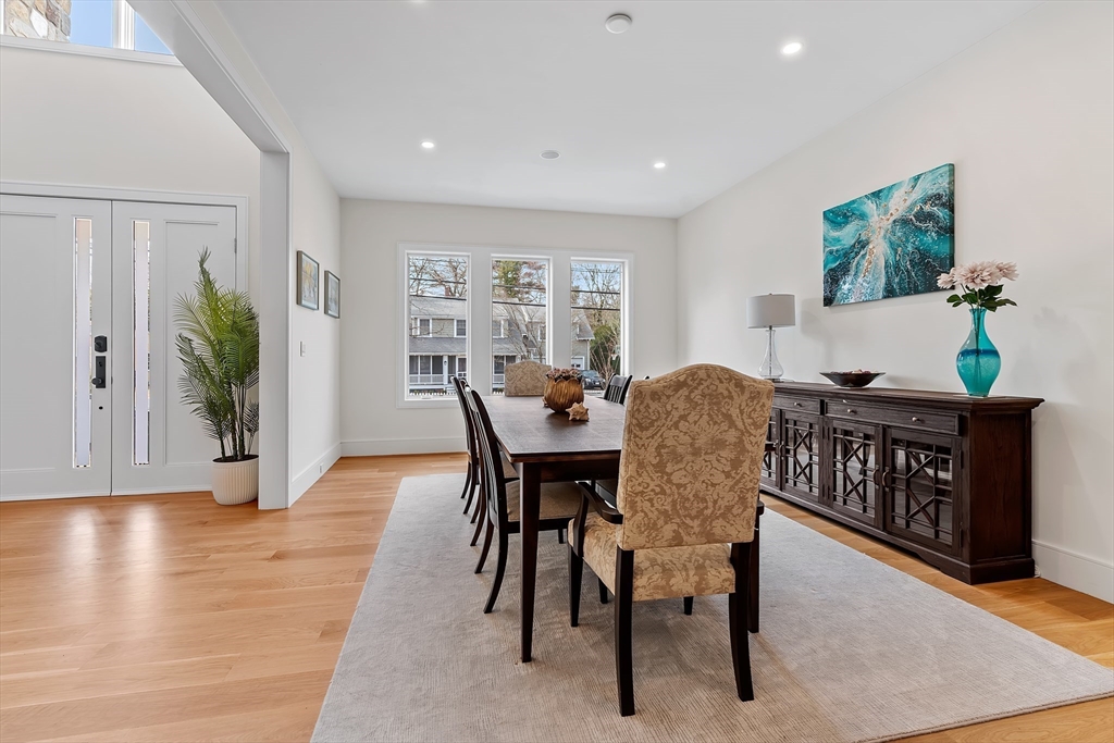 5 Colonial Road, Unit 5 Needham, MA 02492 - Photo 4 of 35 a view of a dining room with furniture window and wooden floor