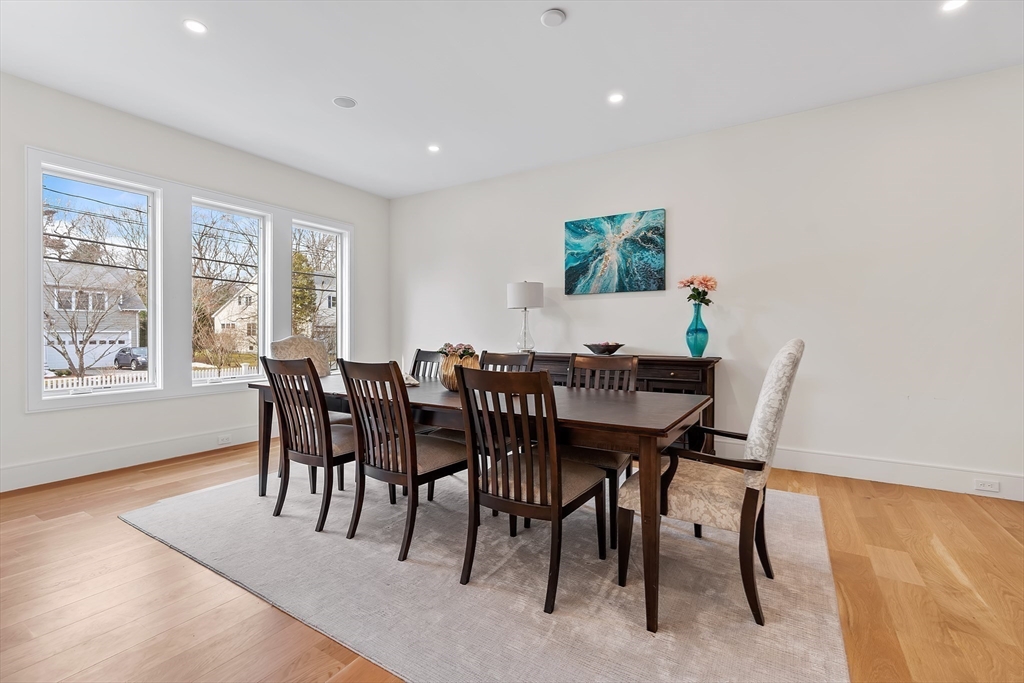 5 Colonial Road, Unit 5 Needham, MA 02492 - Photo 5 of 35 a view of a dining room with furniture and wooden floor