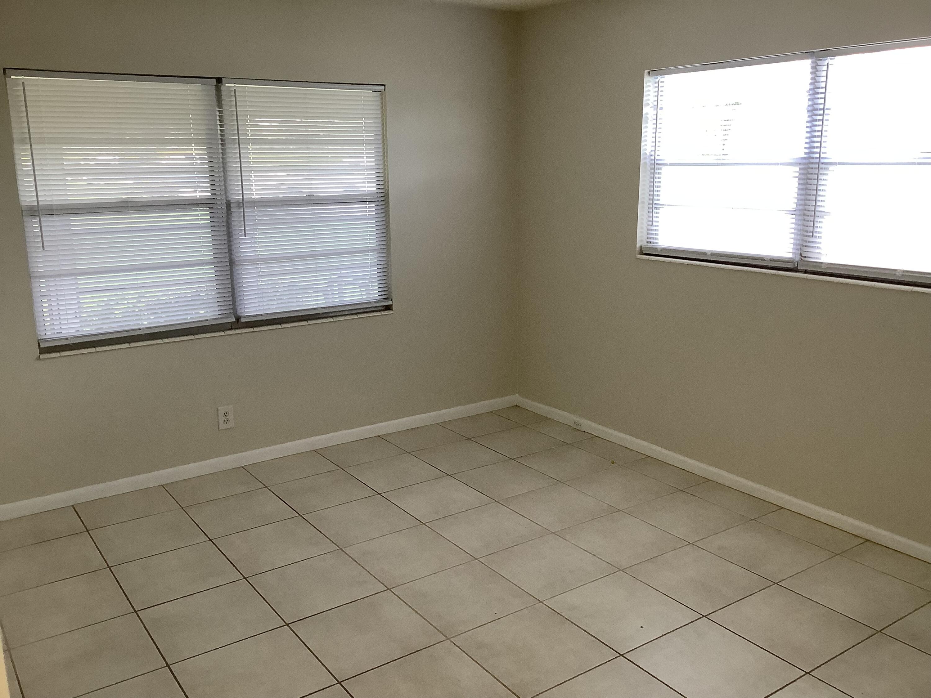 560 Fanshaw North, Unit 560 Boca Raton, FL 33434 - Photo 7 of 26 an empty room with a window