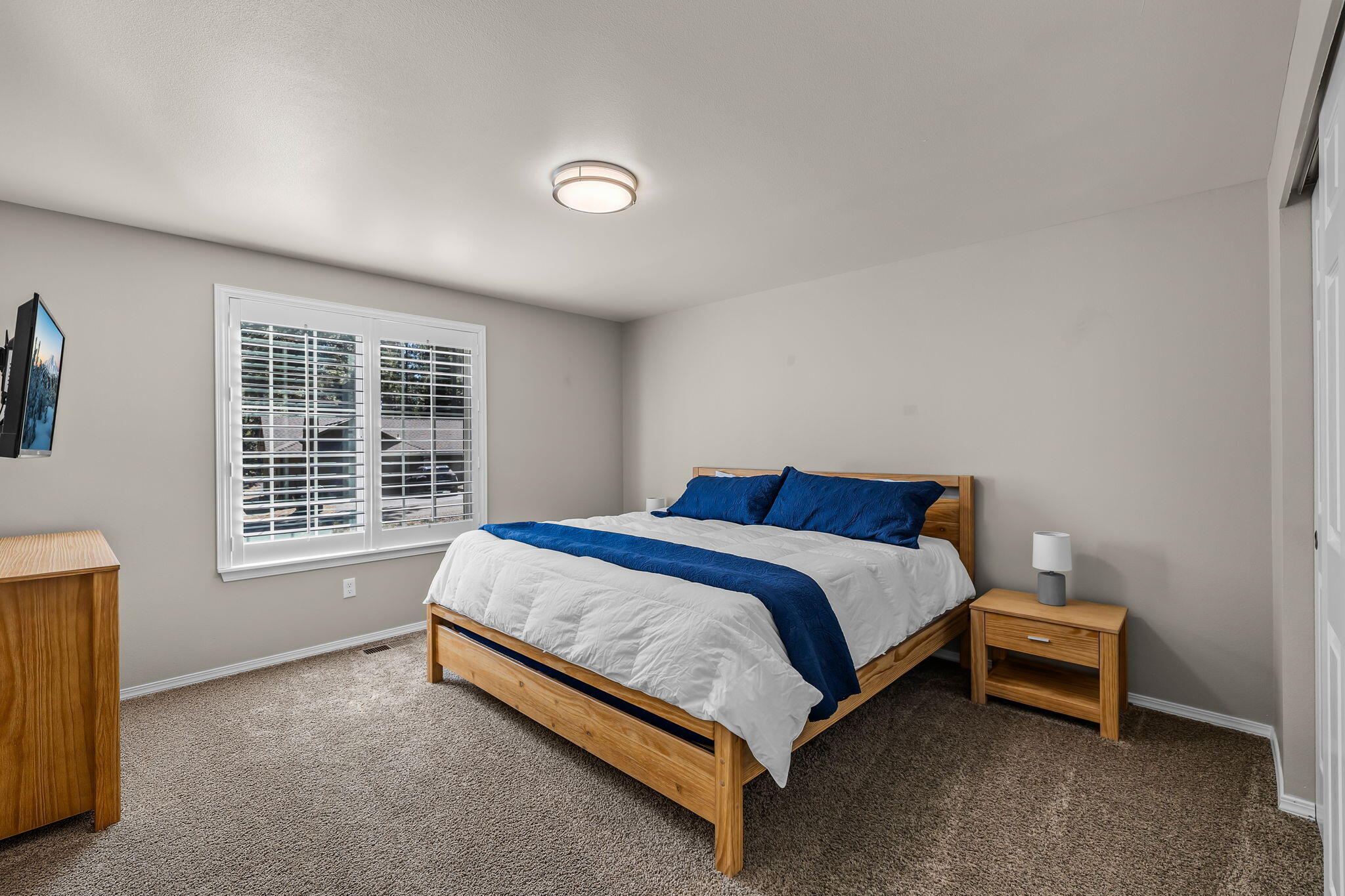 17064 Sacramento Road Bend, OR 97707 - Photo 25 of 50 a bed sitting in a spacious bedroom next to a window