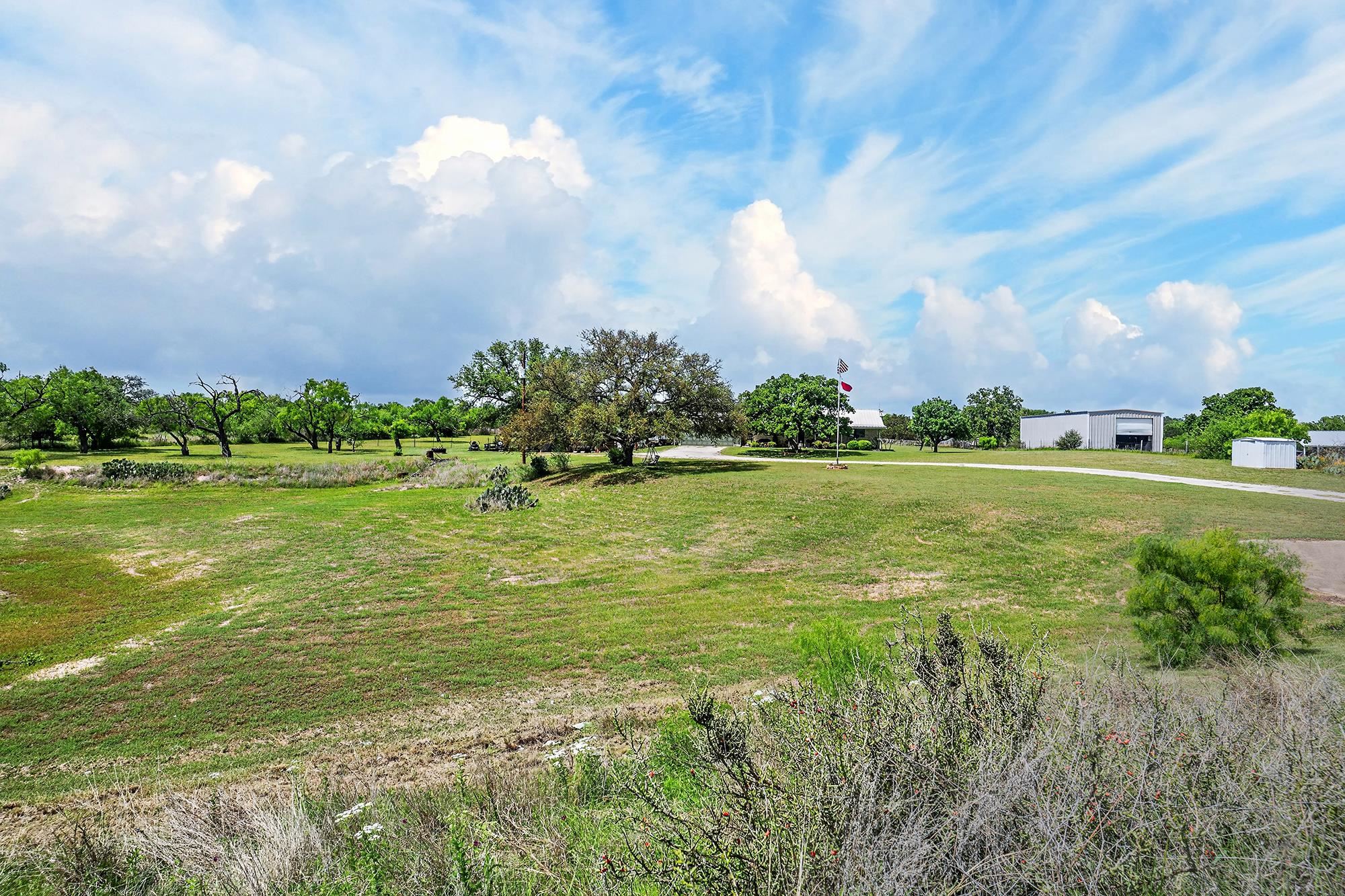 10465 Ranch To Market 1431 Buchanan Dam, TX 78609 - Photo 10 of 29 a view of a golf course with a lake