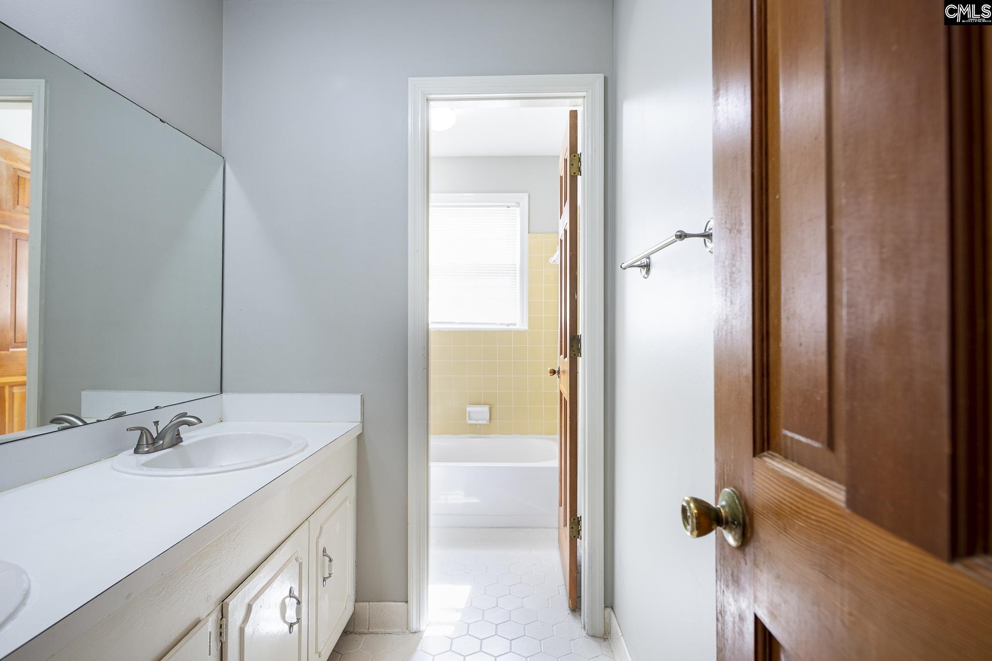 4083 Platt Springs Road West Columbia, SC 29170 - Photo 24 of 35 a bathroom with a sink and mirror