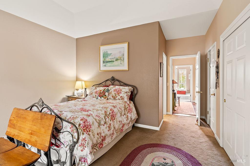 6252 Meadowstone Drive Santa Rosa, CA 95409 - Photo 30 of 33 a bedroom with a bed and a painting on the wall
