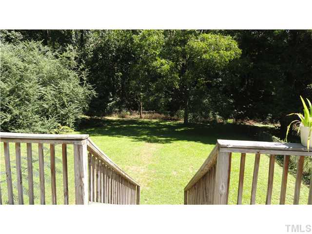 821 Carlisle Street Raleigh, NC 27610 - Photo 18 of 20 Great size fenced in Backyard. Wood buffer behind.