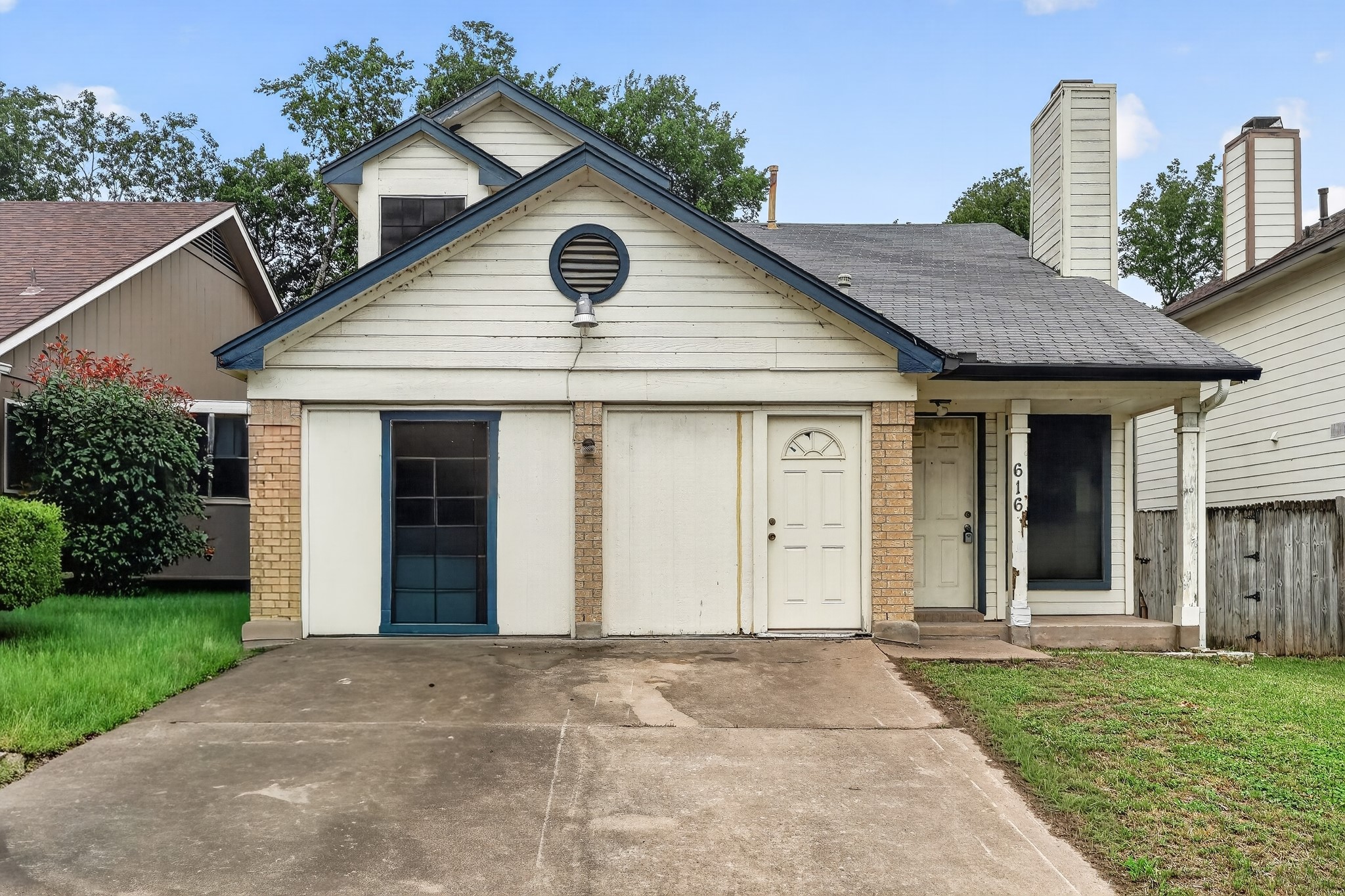 616 Smoke Signal Pass Pflugerville, TX 78660 - Photo 1 of 1 A classic front facade featuring a paved driveway, mature landscaping, and a welcoming covered entry.