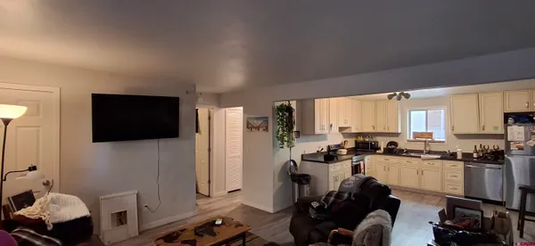 a kitchen with a sink a stove and a refrigerator