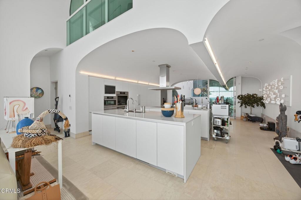 1211 Capri Way Oxnard, CA 93035 - Photo 17 of 63 a room with gym equipment and view of living room