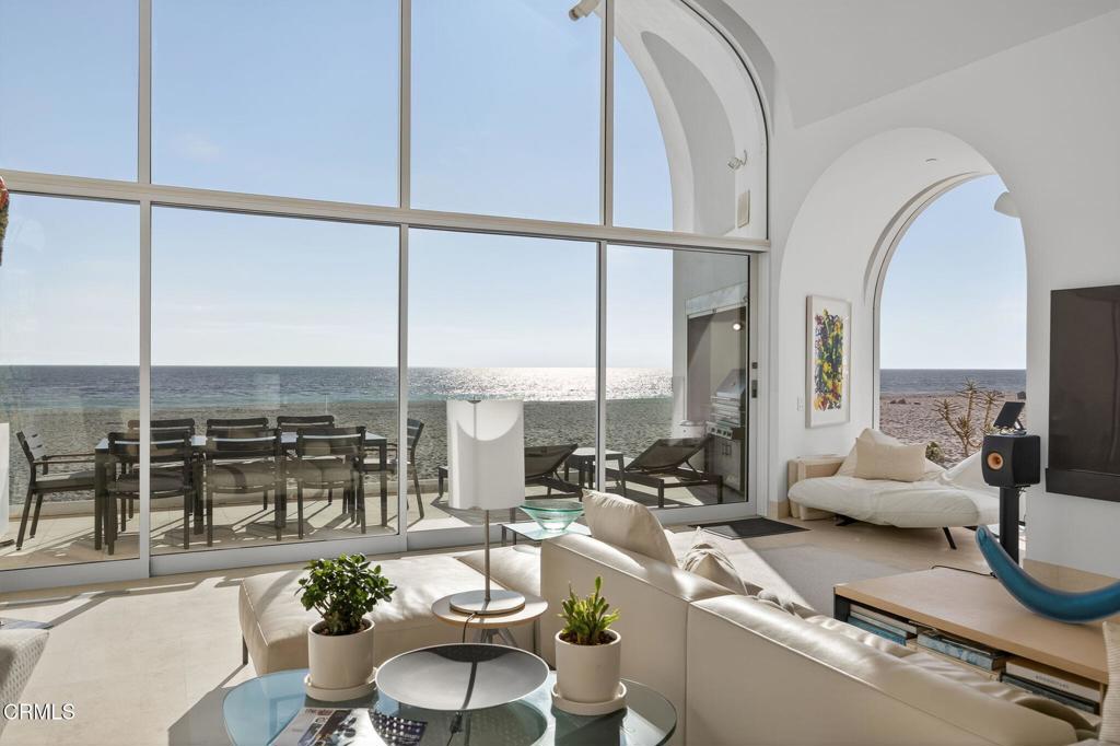1211 Capri Way Oxnard, CA 93035 - Photo 19 of 63 a living room with furniture and a floor to ceiling window