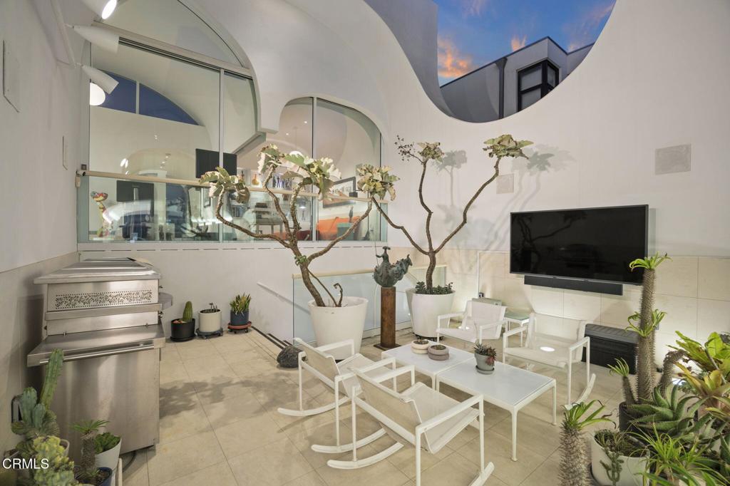 1211 Capri Way Oxnard, CA 93035 - Photo 27 of 63 a view of a livingroom with furniture and a flat screen tv