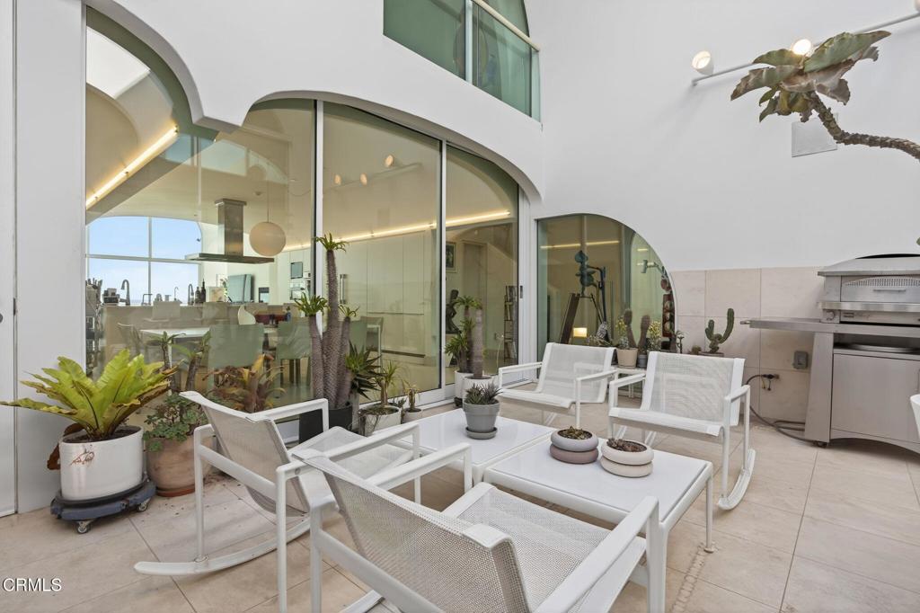 1211 Capri Way Oxnard, CA 93035 - Photo 30 of 63 a dining room with furniture and a potted plant