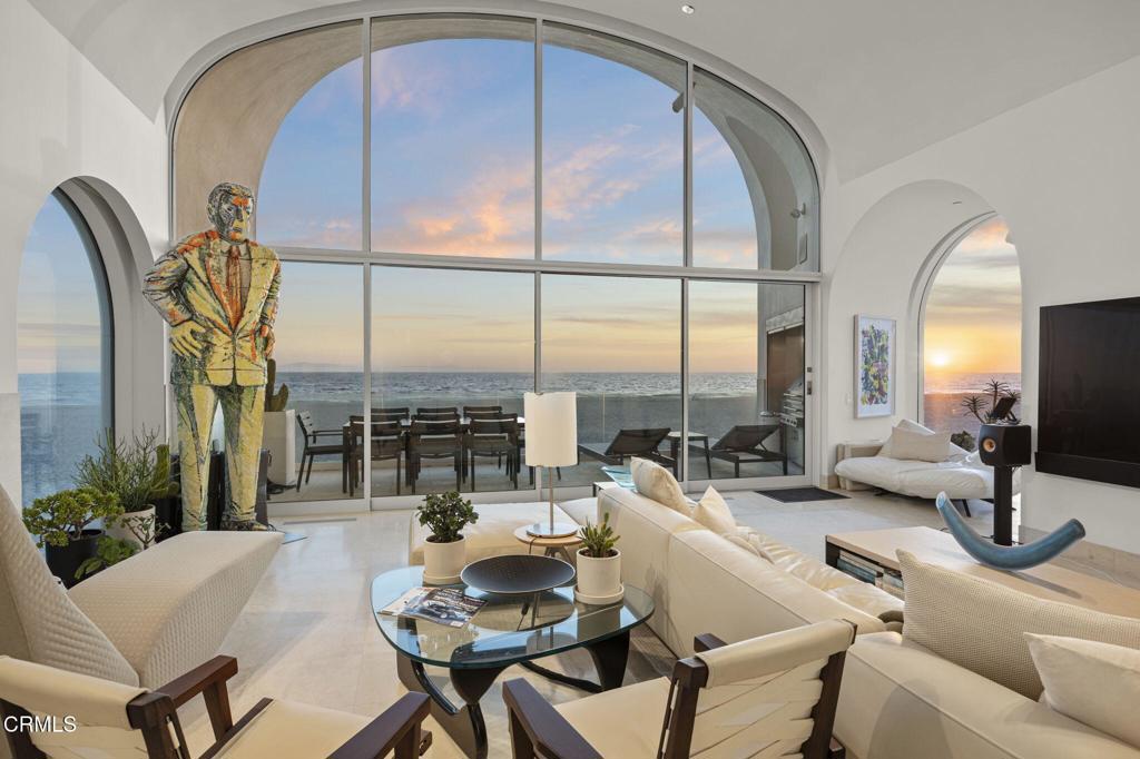 1211 Capri Way Oxnard, CA 93035 - Photo 3 of 63 a living room with couches a coffee table and chandelier