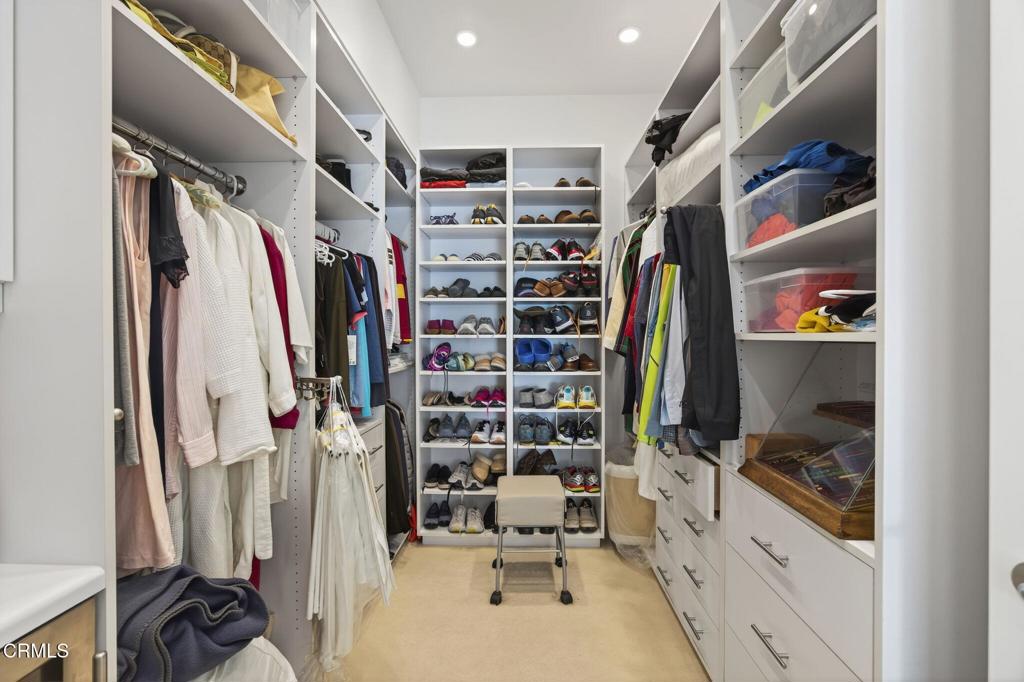 1211 Capri Way Oxnard, CA 93035 - Photo 37 of 63 a view of walk in closet with clothes and shoes