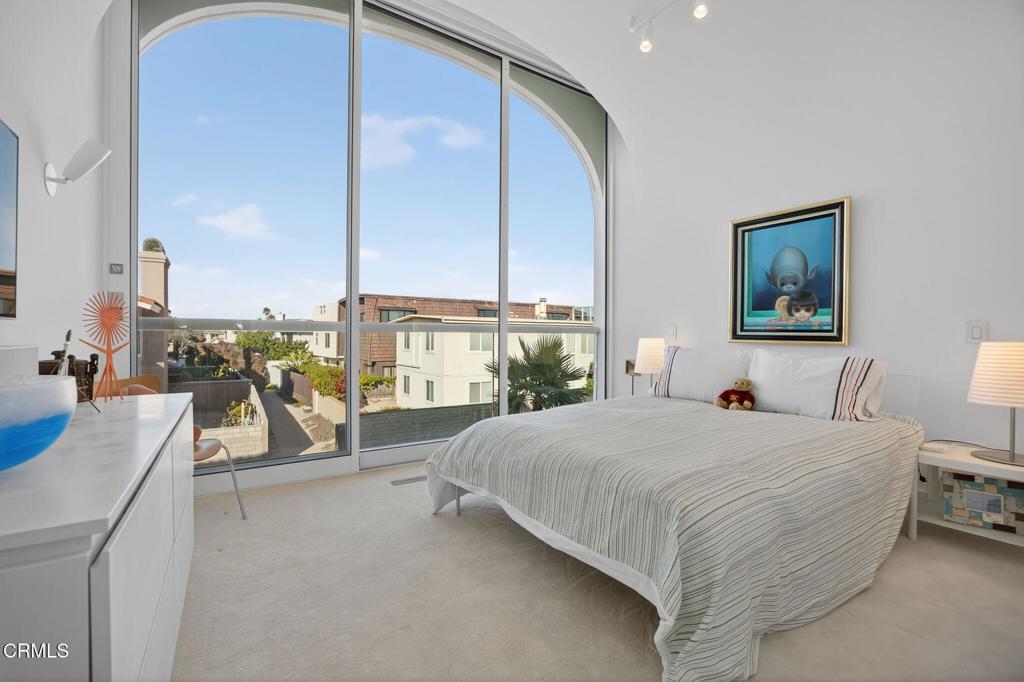 1211 Capri Way Oxnard, CA 93035 - Photo 42 of 63 a bedroom with a bed and large window