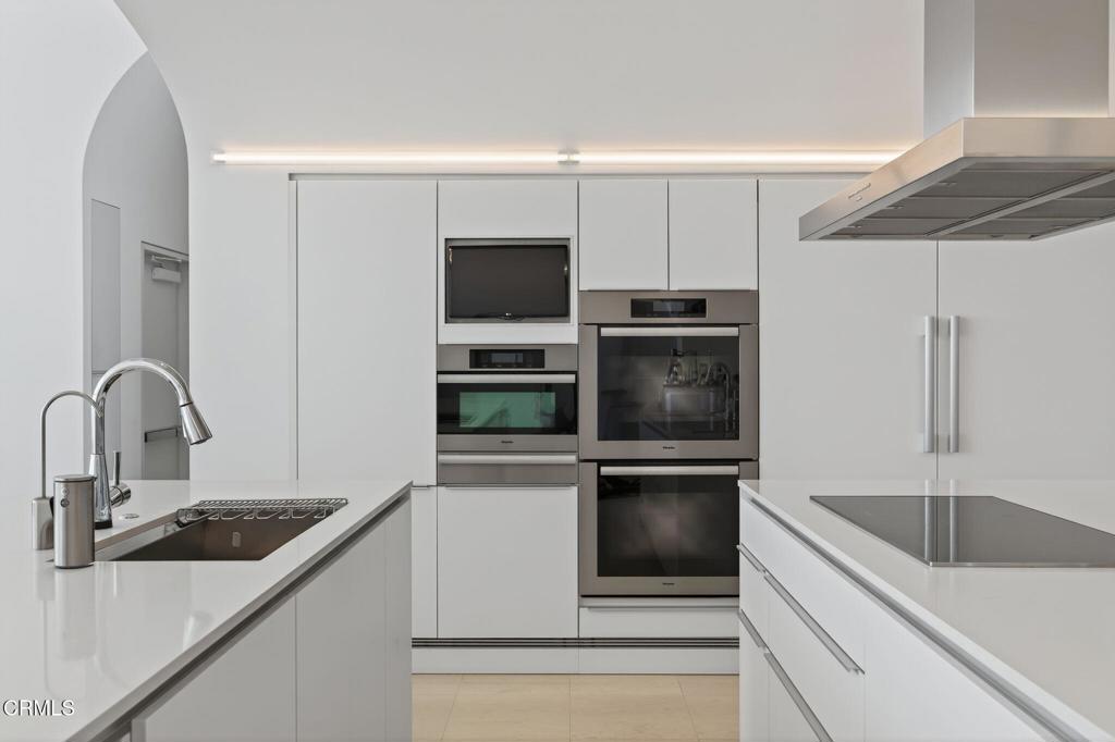 1211 Capri Way Oxnard, CA 93035 - Photo 8 of 63 a kitchen with a sink and stainless steel appliances