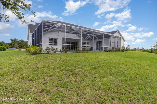 a view of a living room with kitchen