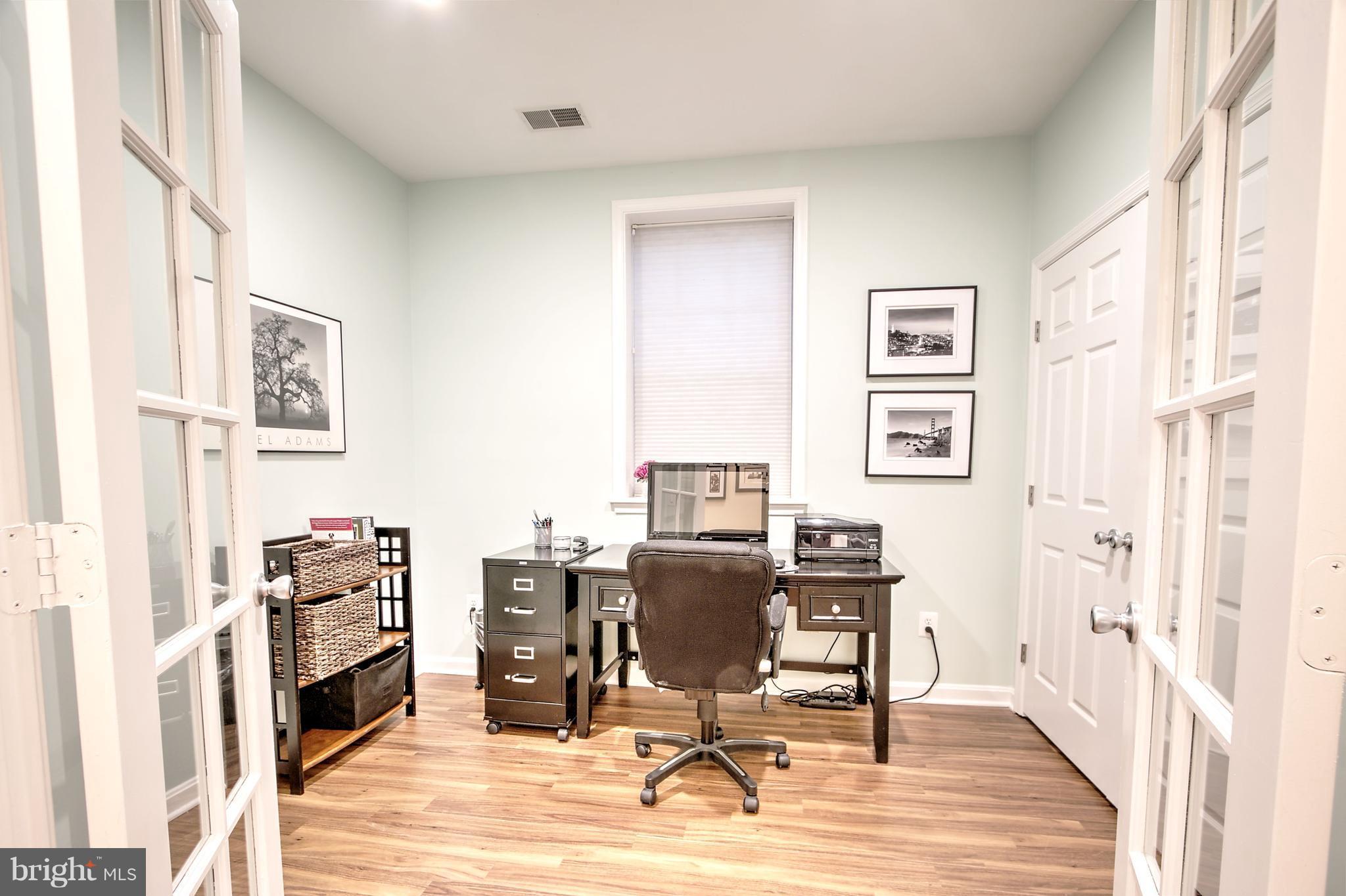 11315 Sundial Court, Unit 212 Reston, VA 20194 - Photo 13 of 18 a view of a workspace with furniture and a window