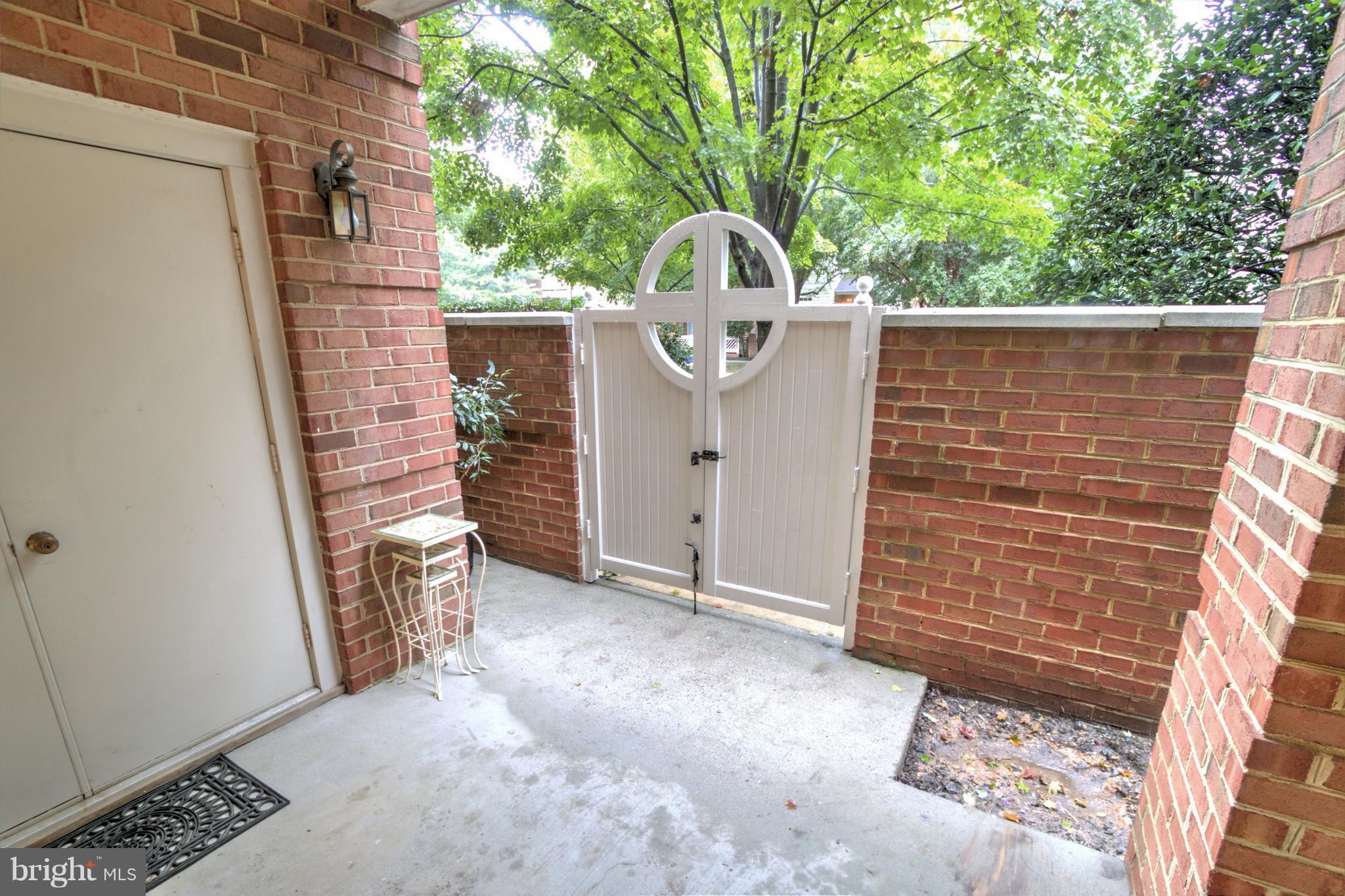 11315 Sundial Court, Unit 212 Reston, VA 20194 - Photo 14 of 18 a view of a wooden door and a yard