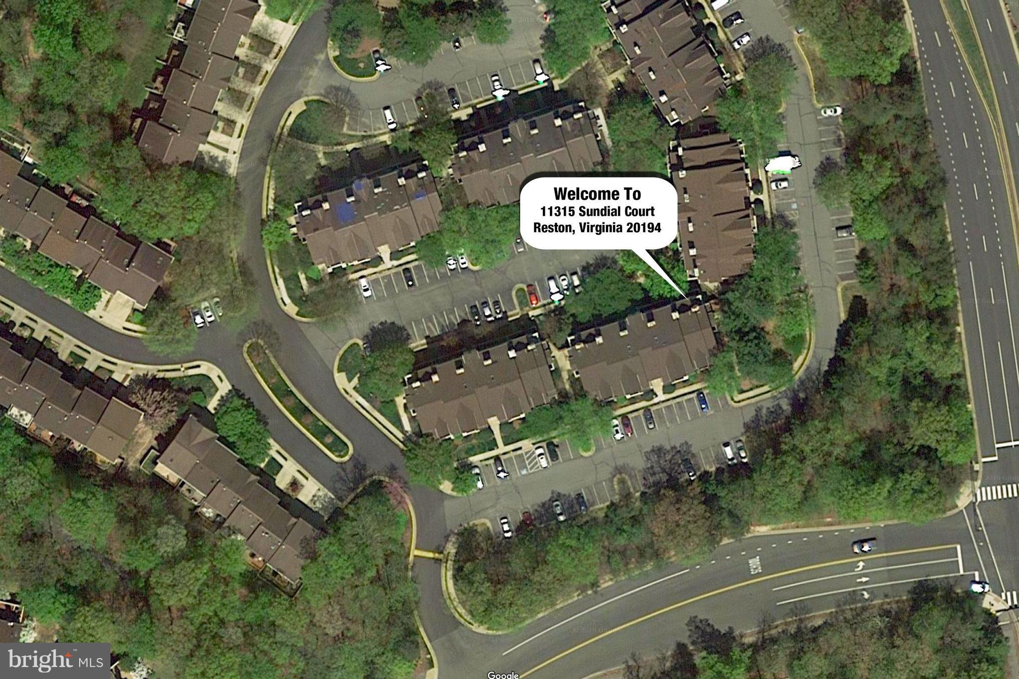 11315 Sundial Court, Unit 212 Reston, VA 20194 - Photo 17 of 18 an aerial view of residential houses with outdoor space