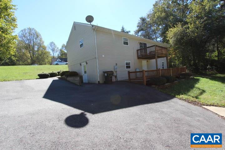376 North Ridge Way Ruckersville, VA 22968 - Photo 15 of 16 a front view of a house with garden