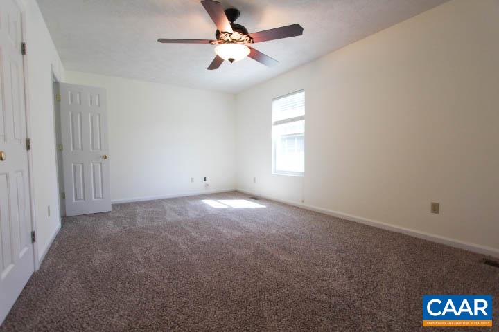 376 North Ridge Way Ruckersville, VA 22968 - Photo 6 of 16 an empty room with windows and chandelier fan