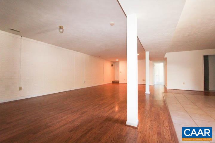 376 North Ridge Way Ruckersville, VA 22968 - Photo 9 of 16 a view of an empty room with wooden floor