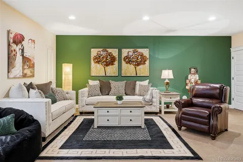 a living room with furniture and a rug