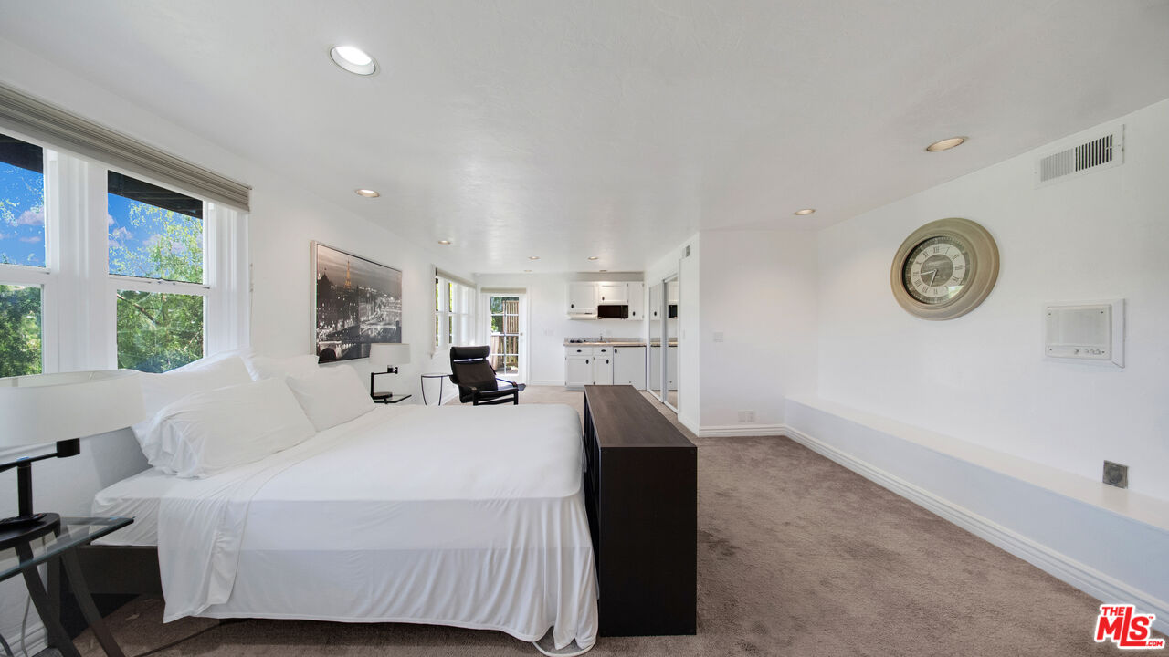 2312 Kimridge Road Beverly Hills, CA 90210 - Photo 49 of 60 a bedroom with a bed and a window